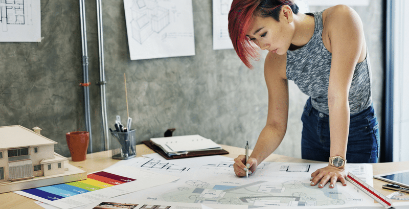 Woman Working on Design Plans