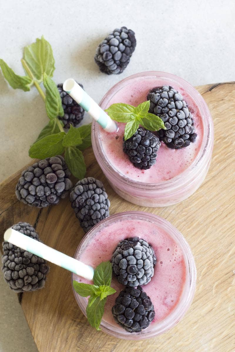 Blueberry Smoothie - Simple Smoothie Recipes Purple smoothie on table- new year's resolutions