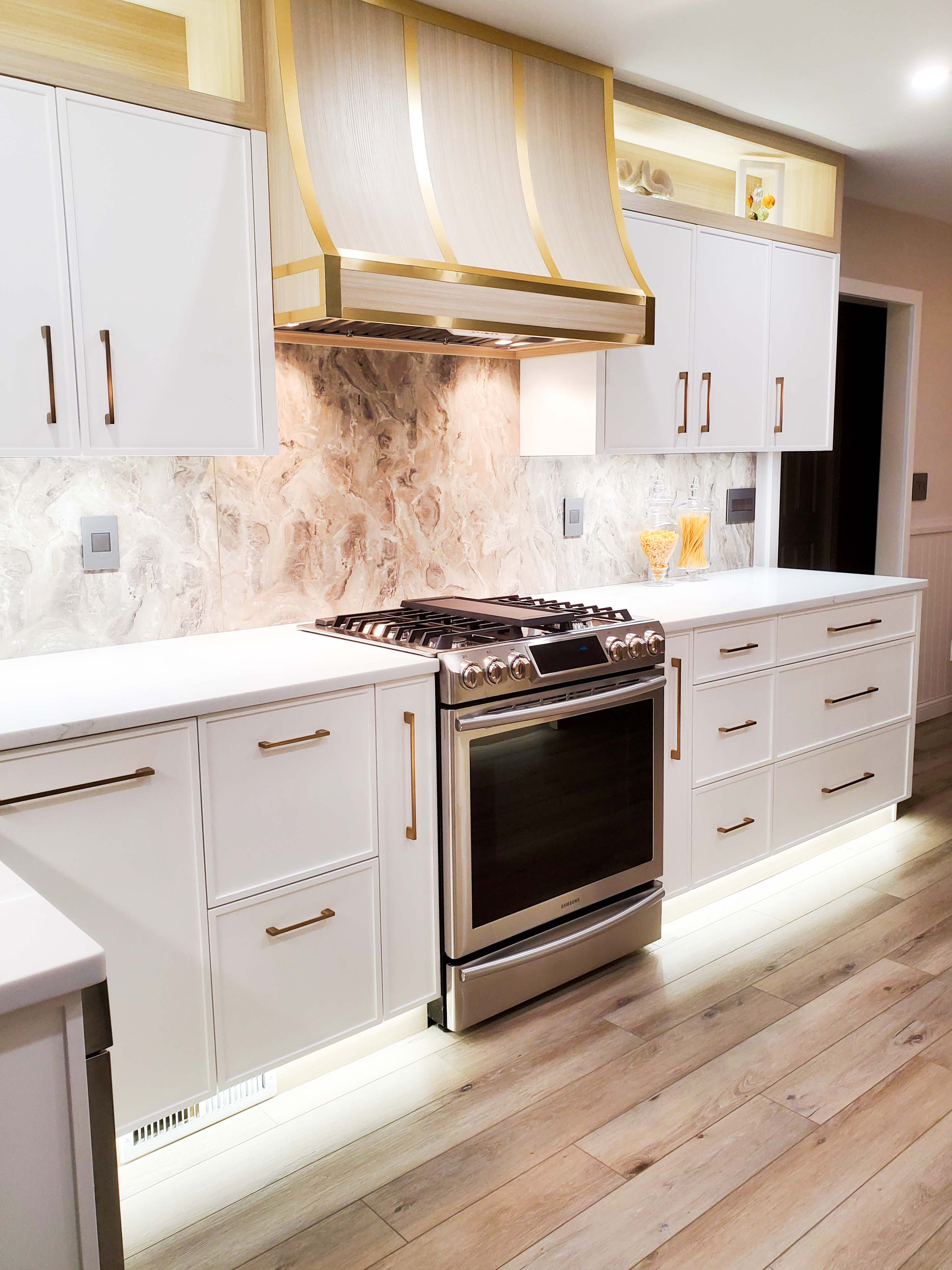 White range hood cover with golden trim