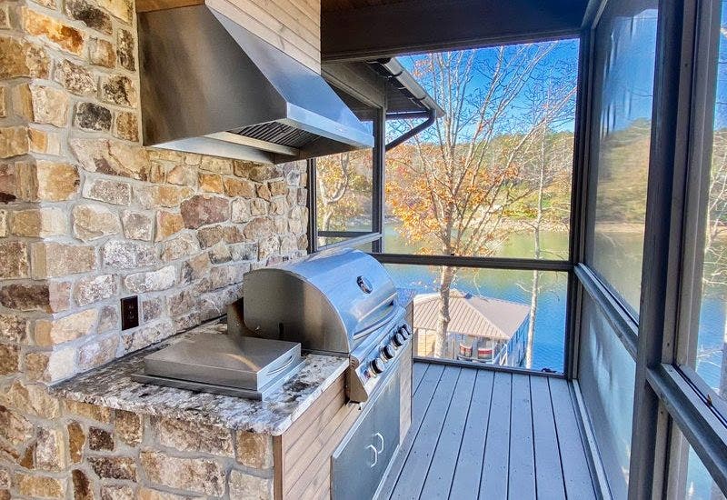 Stainless Steel Grill and Hood in Enclosed Kitchen