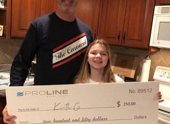 Proline Photo Contest Winner With Check