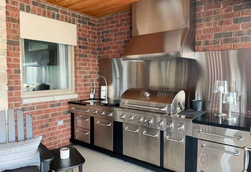 Brick Outdoor Kitchen with Hood and Grill