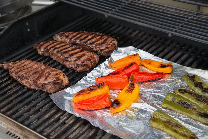 Meats and Vegetables on the Grill in Foil