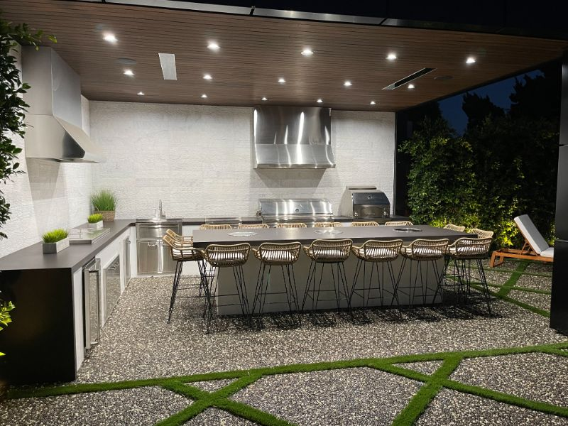 Two range hoods in covered patio with built in LEDs