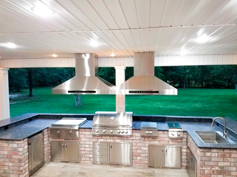 Double range hood over grill and griddle