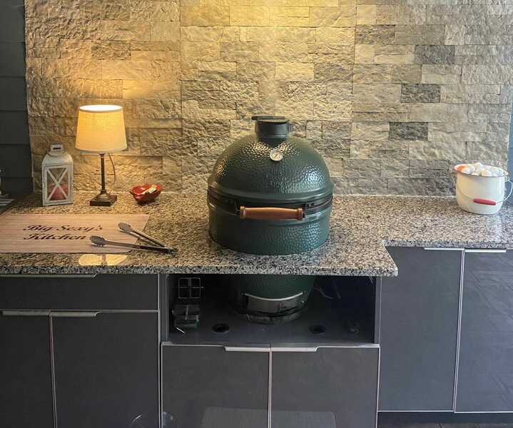 Green egg grill with counter lamp