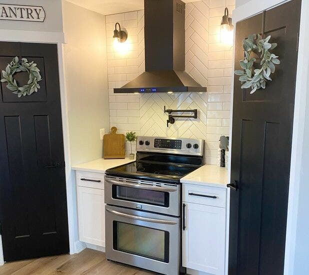 Black vent hood in small kitchen