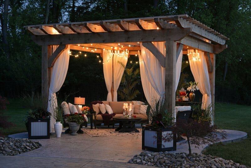 Covered Lit Patio with Outdoor Curtains