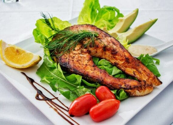 Fish with Salad.  Colorful Salad with Assorted Veggies