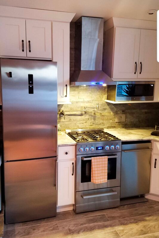Vent hood with lights on over small stove