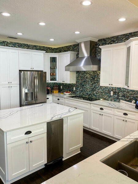 Kitchen with island and cabinetry with cup pulls