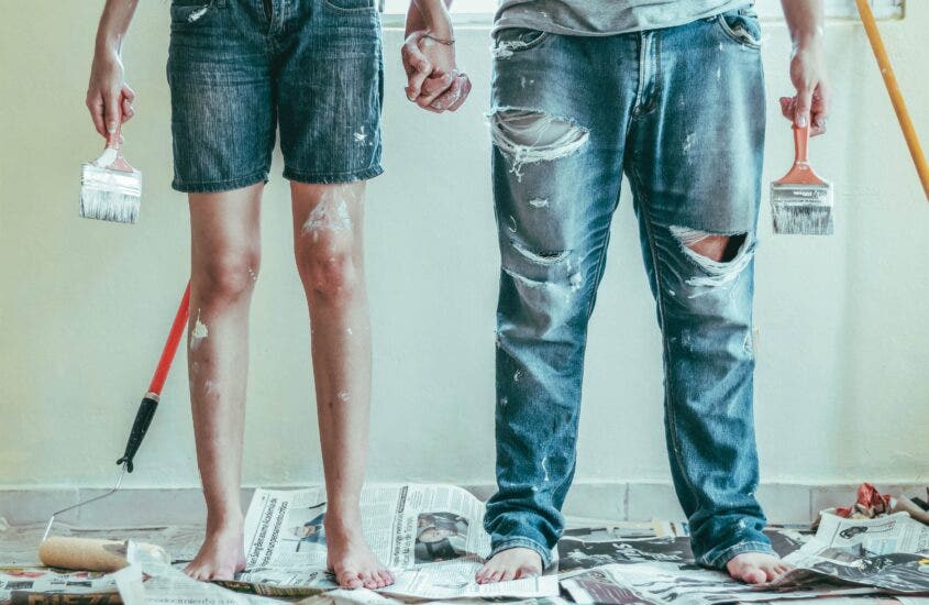 a couple holding hands with paint all over them - DIY projects that are easy and fast