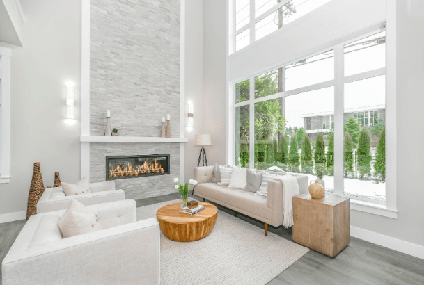 clean bright livingroom with a fire in the fireplace