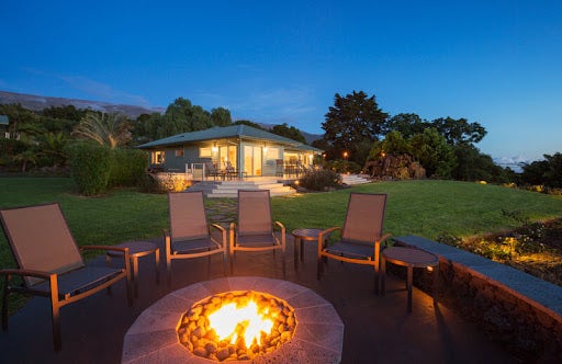 Gas fire pit with chairs on a patio
