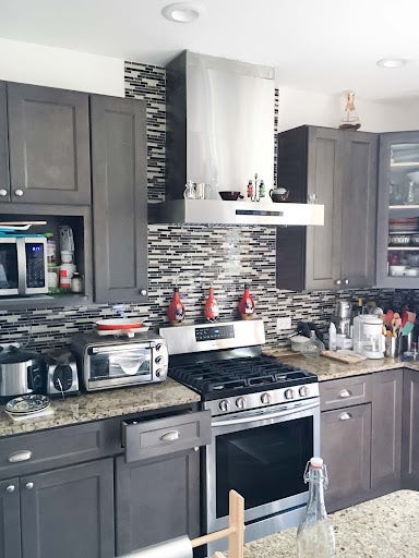 Small Wall Vent Hood with Black and White Backsplash