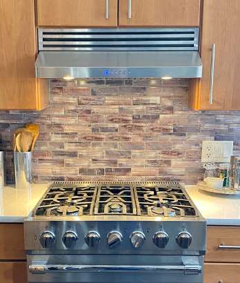 Range hood with a recirculating kit on it and charcoal filters in it