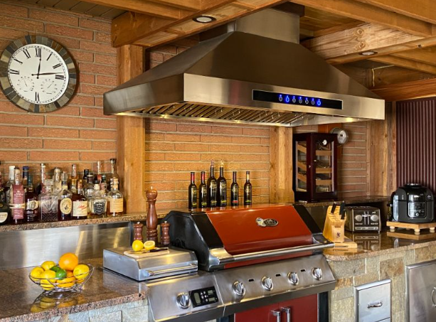 a different angle - outdoor kitchen idea number 5
stainless steel appliances with a big range hood over a grill and lots of dressings and knives and stone all around