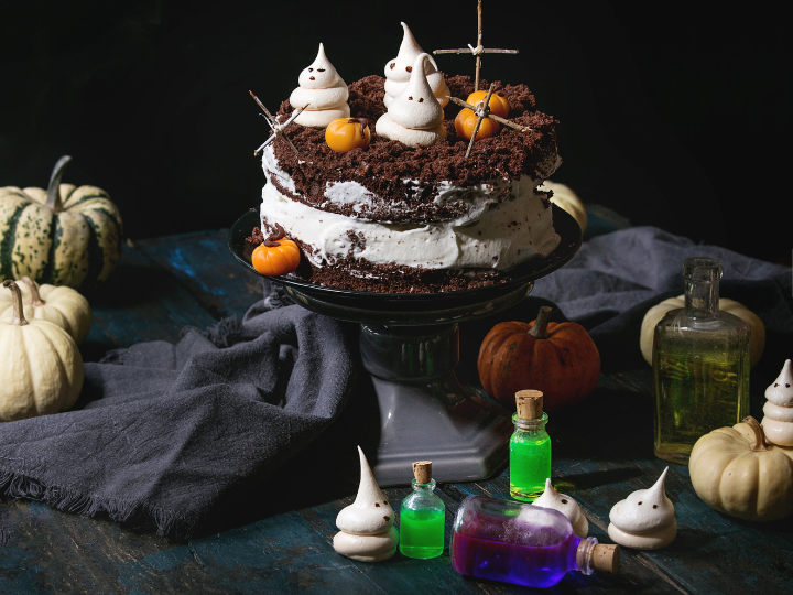 Halloween kitchenware. Halloween-themed cake. Halloween table decorations