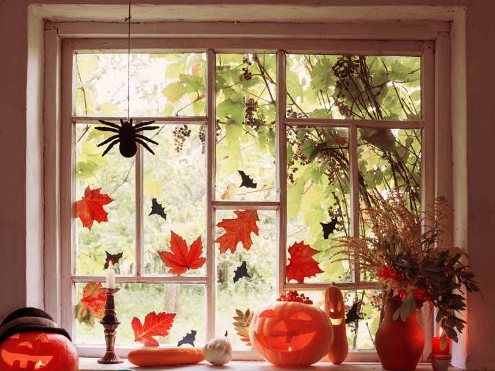 Halloween decorations for windows. Fall leaves window decoration. Spider decoration. Jack o lantern in a window