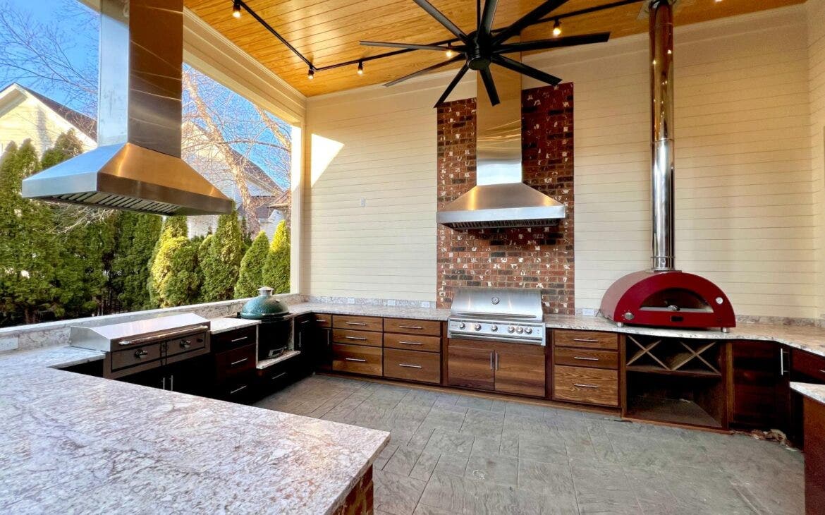 outdoor range hood in a backyard covered kitchen
