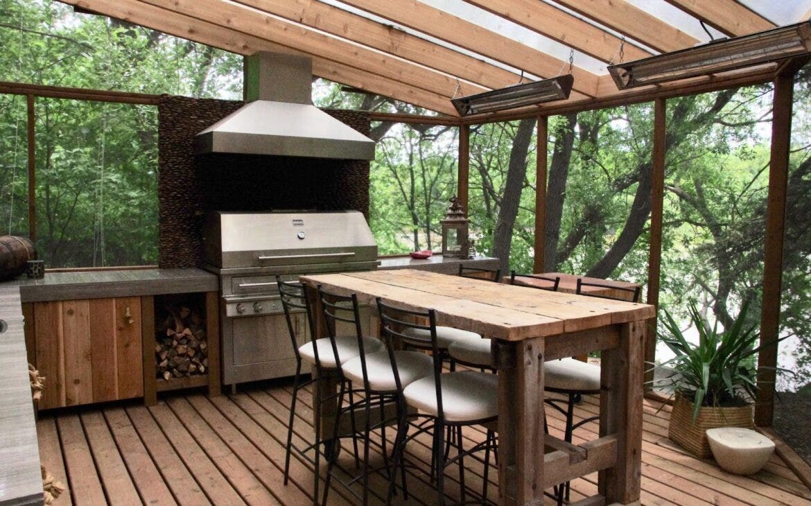 outdoor kitchen with a range hood in the woods - Proline Range Hoods - prolinerangehoods.com 