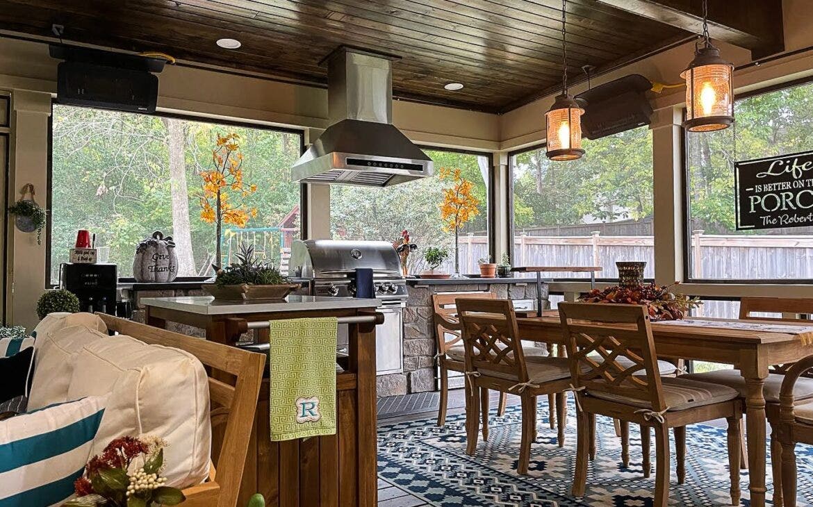 outdoor kitchen with seating area  - Proline Range Hoods - prolinerangehoods.com