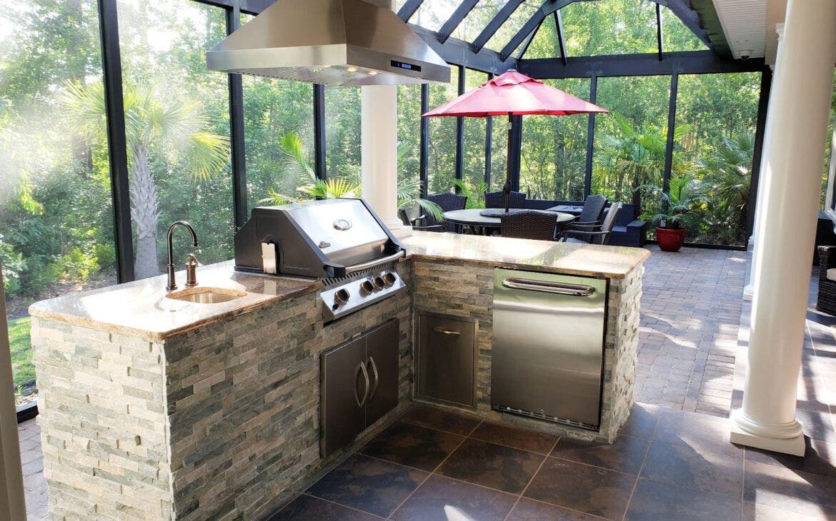 Dreamy Alfresco Kitchen: Proline hood ensures smokeless grilling in this beautiful outdoor space with ample gathering areas.  - Proline Range Hoods - prolinerangehoods.com Perfect for enjoying the outdoors!