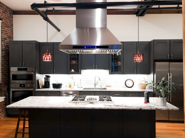 an indoor island hood that is 6 inches wider than the cooktop over an island - prolinerangehoods.com